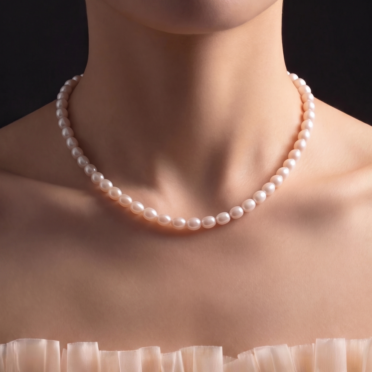 Hand-matched 5.5–6mm AAAA rice pearls — strand detail