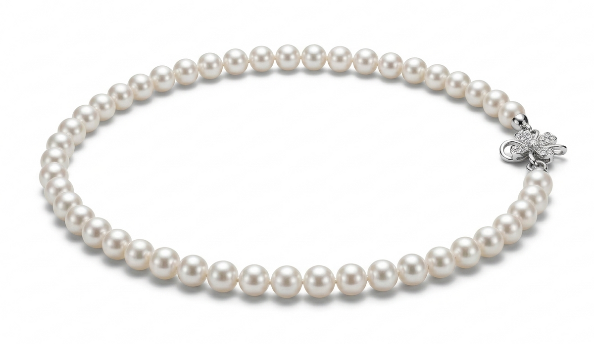 Premium AAAA round pearl necklace shown worn at the neckline