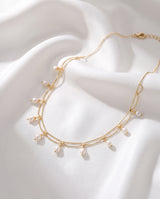 Gold Pearl Fringe Necklace on white silk
