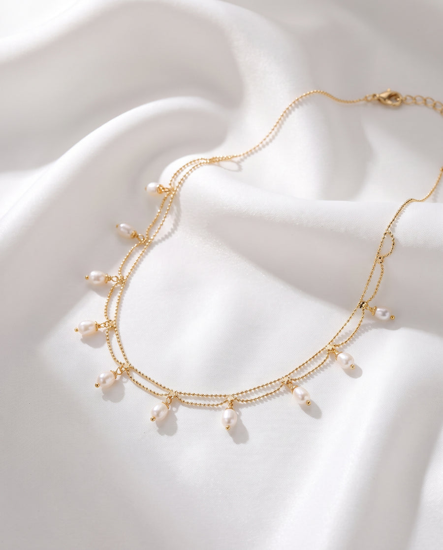 Gold Pearl Fringe Necklace on white silk