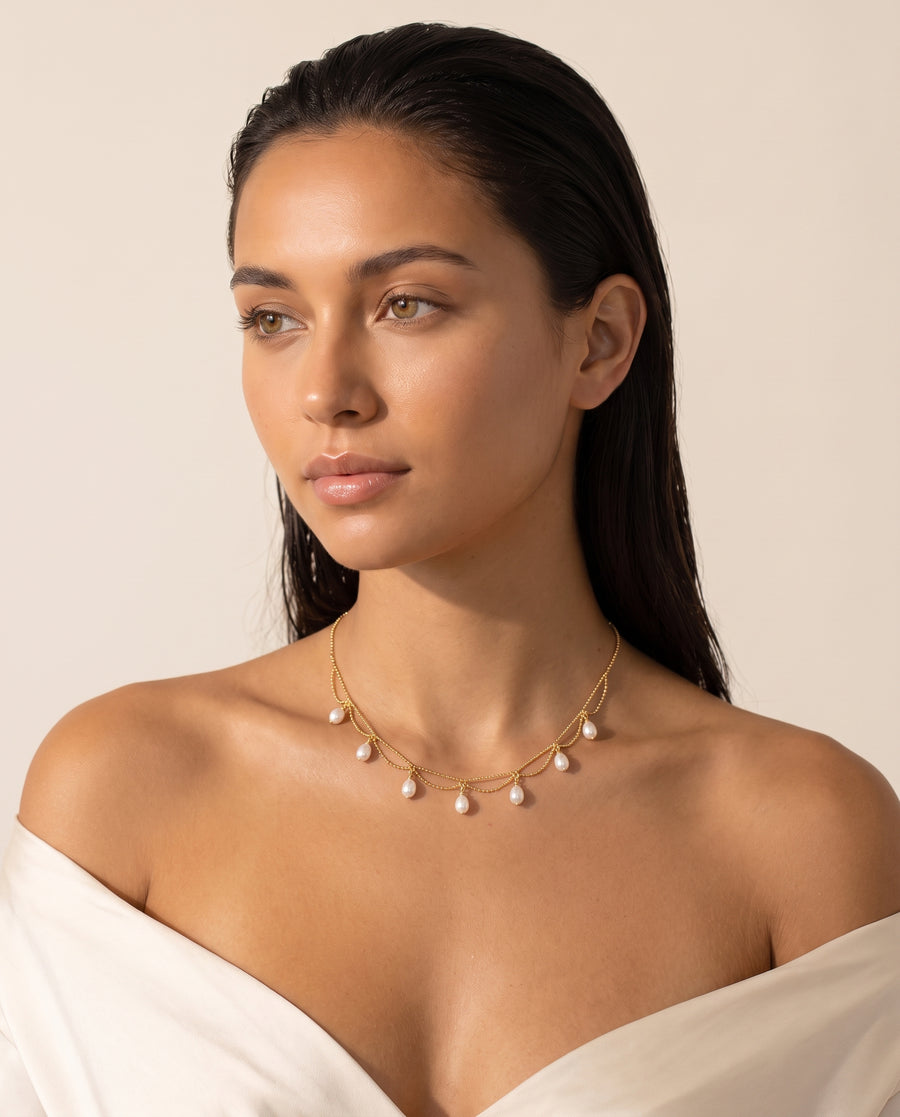 Model wearing Gold Pearl Fringe Necklace, side view