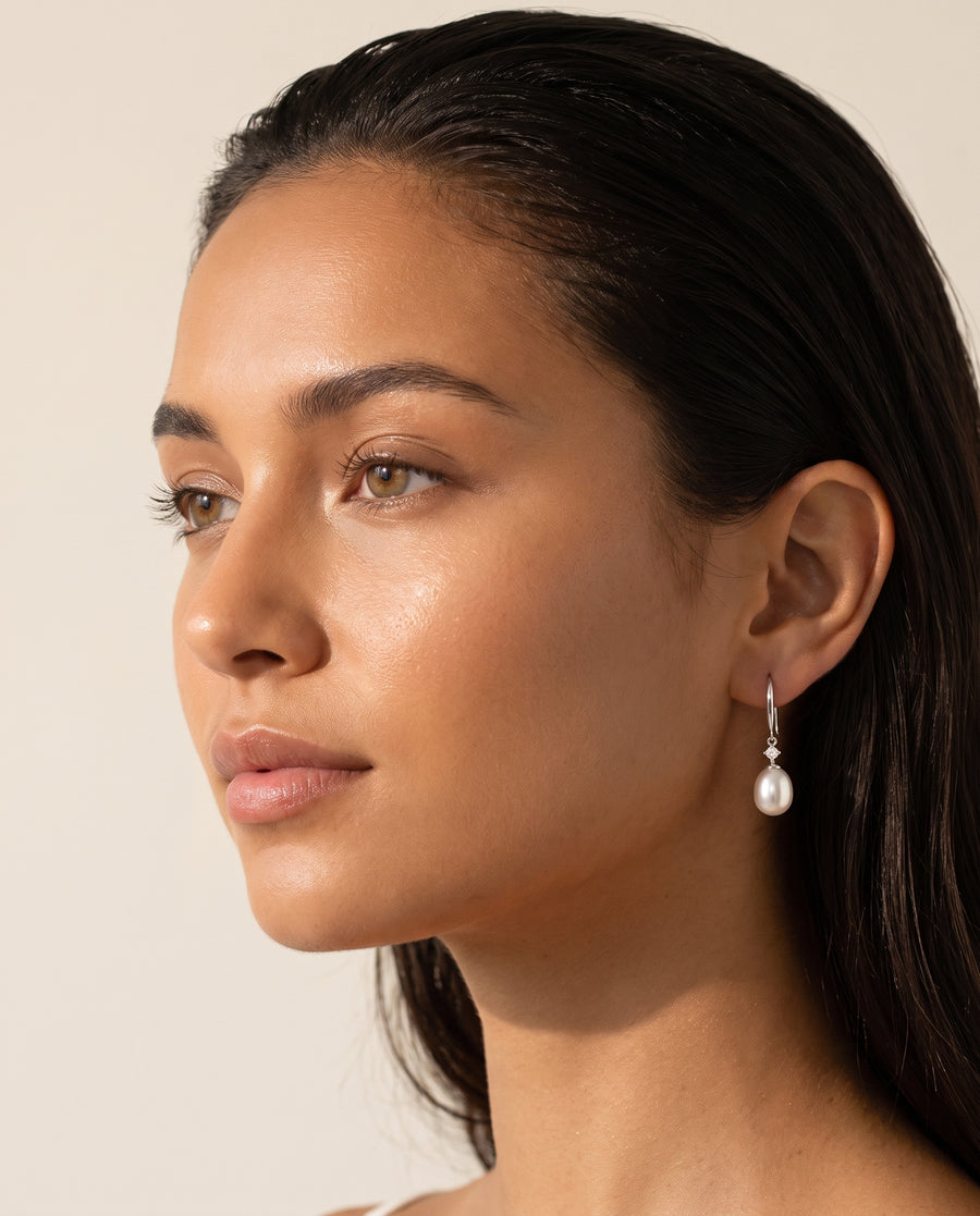 Freshwater pearl drop earring, profile view on the ear