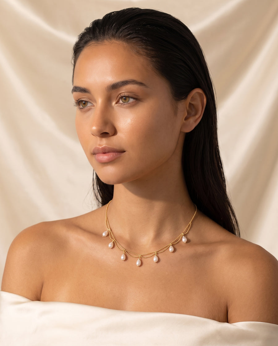 Model wearing Gold Pearl Fringe Necklace, close crop