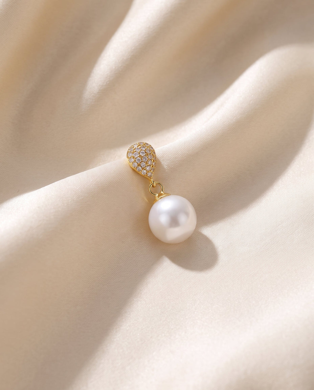 Gold pave pearl drop earring, freshwater pearl, draped on champagne silk