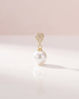 Gold pave pearl drop earring, freshwater pearl, on a glossy pedestal