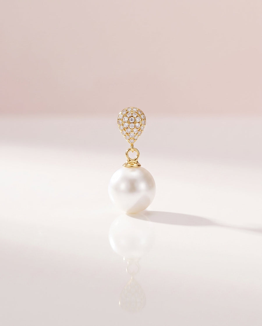 Gold pave pearl drop earring, freshwater pearl, on a glossy pedestal