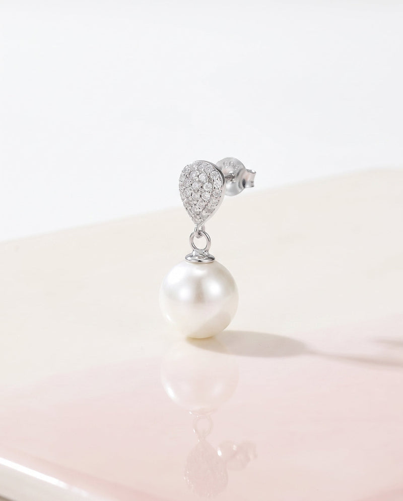 Silver pave pearl drop earring, freshwater pearl, on a glossy pedestal