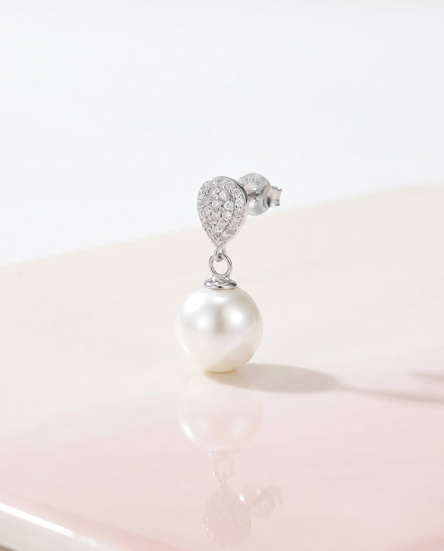 Silver pave pearl drop earring, freshwater pearl, on a glossy pedestal