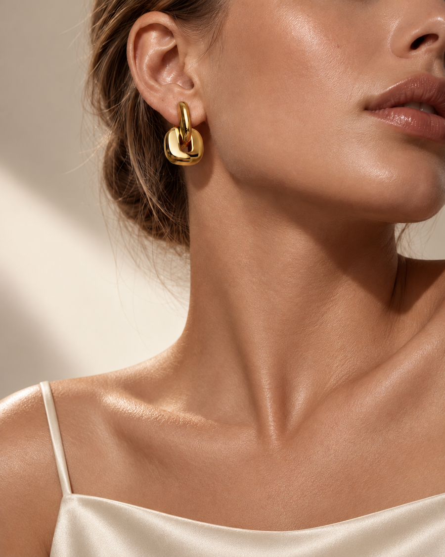Tandem link huggie earrings in 18k gold plated stainless steel, side view showing hinge closure