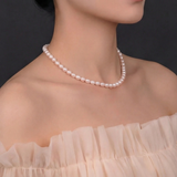 Hardly Common rice pearl necklace alternate angle on neutral background