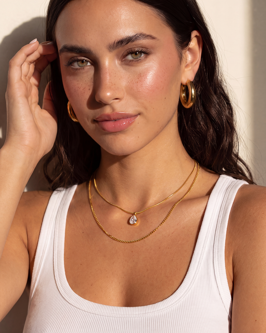 Model tucking hair behind her ear, both layers visible
