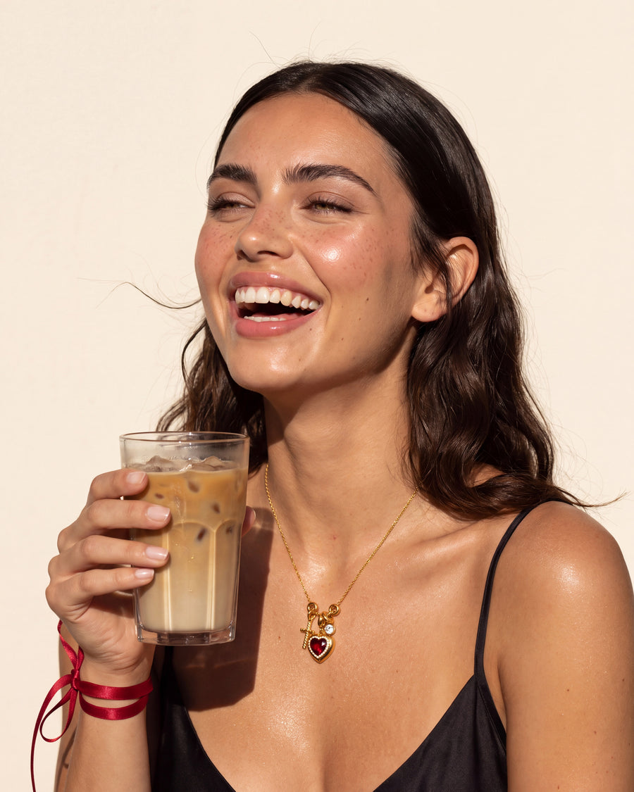 The necklace worn in daylight with an iced coffee, everyday wear