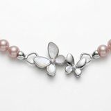 Lavender freshwater pearl close-up — natural purple-mauve bodycolor with rosé overtone