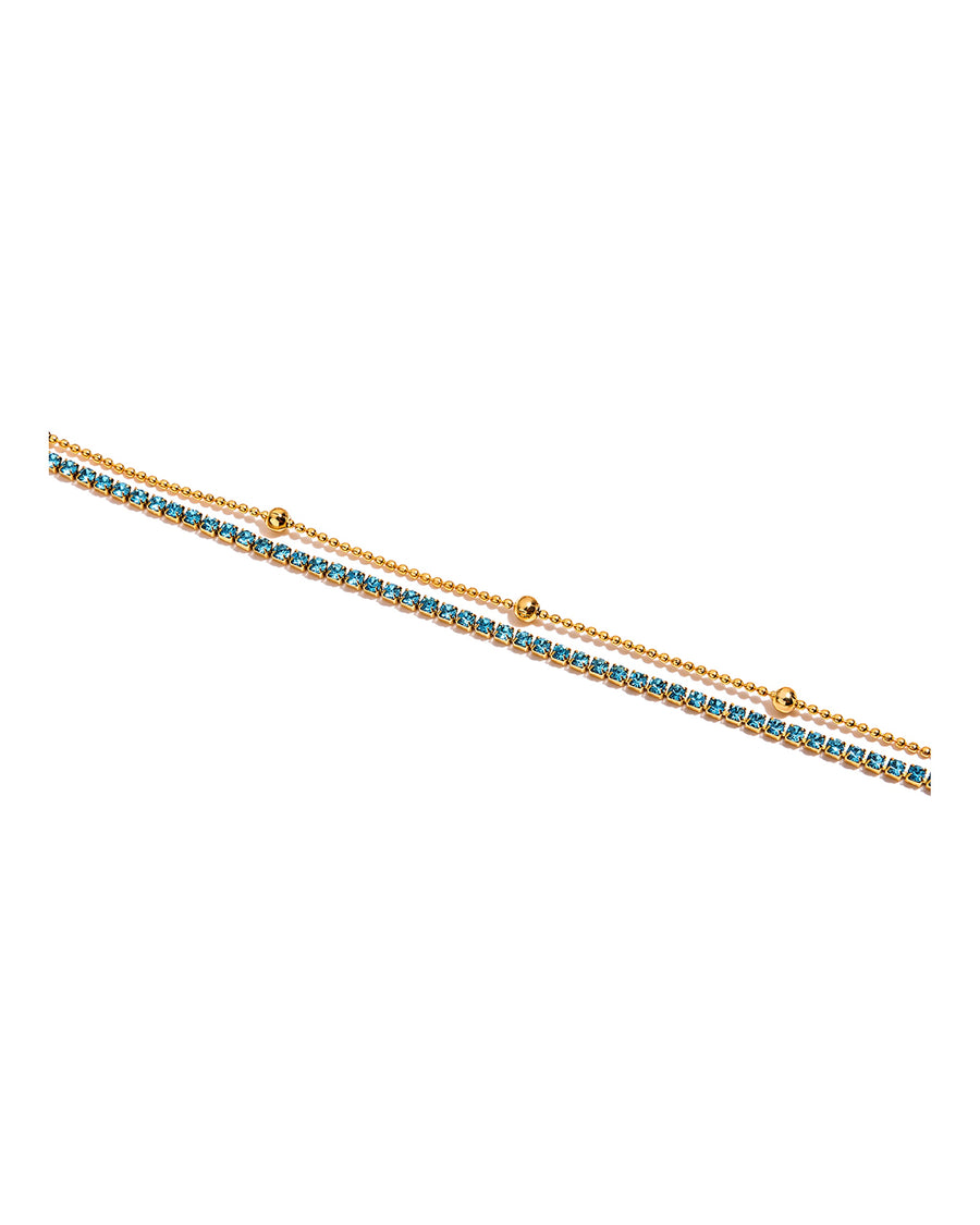 Aqua crystal tennis bracelet with gold ball chain on pure white