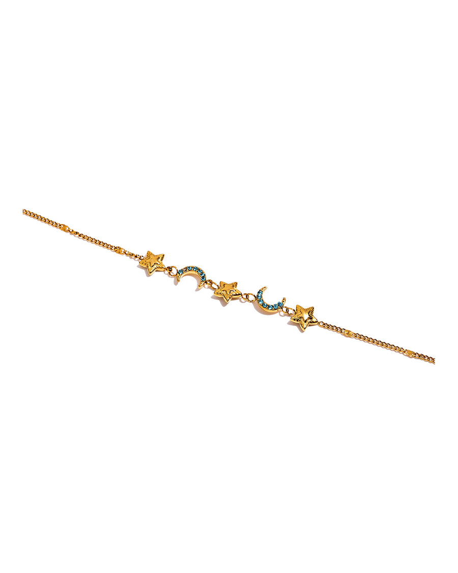 Gold star and pave aqua crescent moon bracelet on pure white