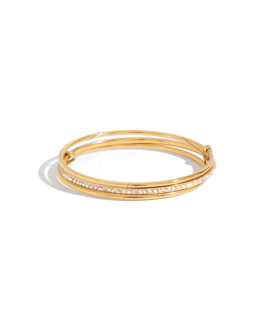 Interlock bangle in 18k gold plated stainless steel on white