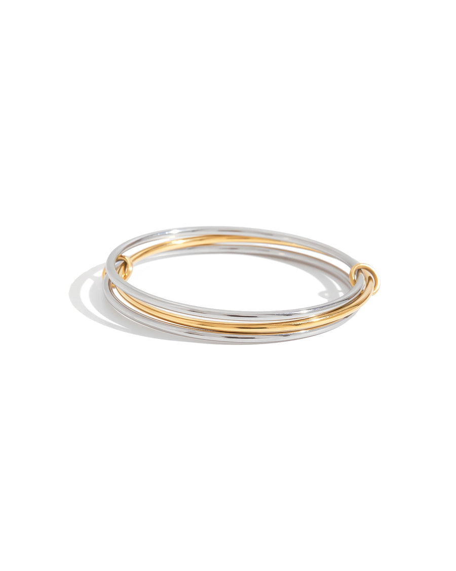 Trio interlock bangle in silver, gold and silver on white
