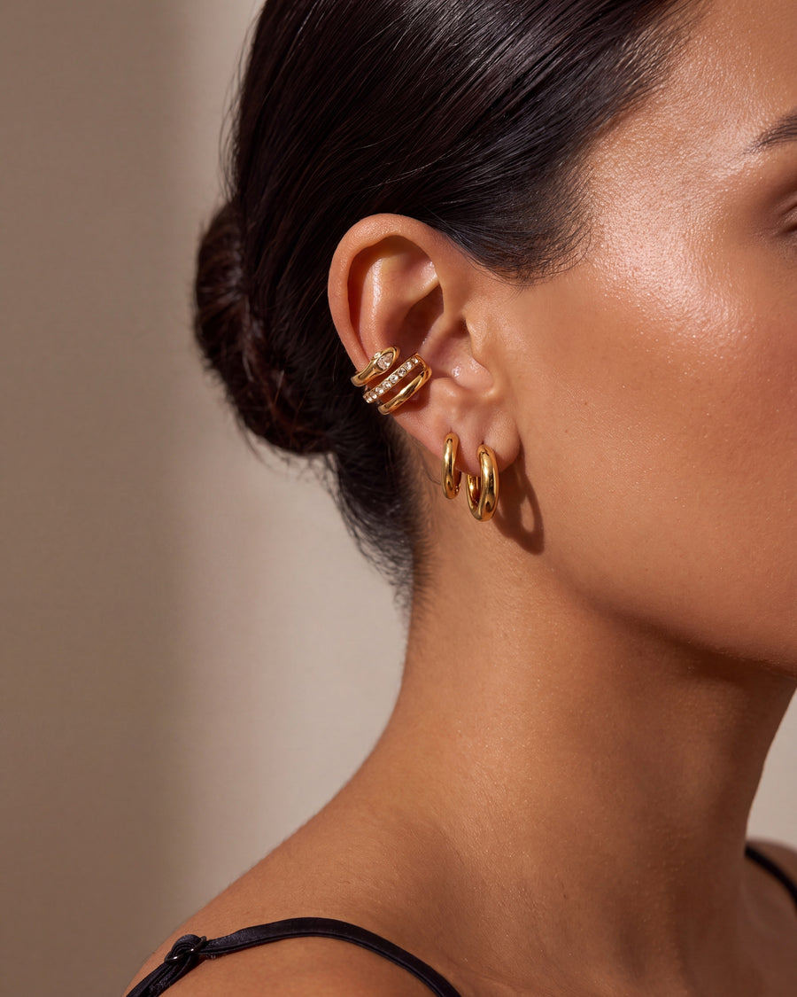 Ear cuff at conversational distance, showing its small everyday scale