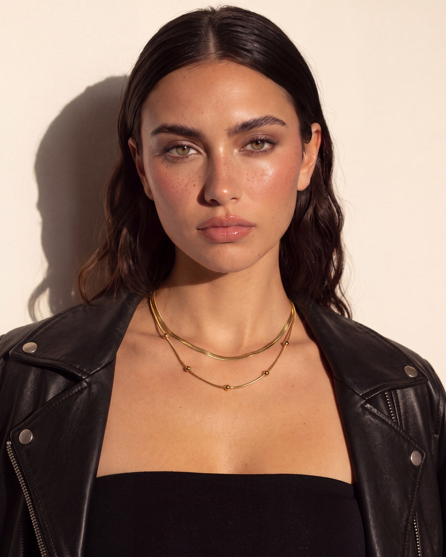Model wearing the Herringbone Layered Necklace Set, front view