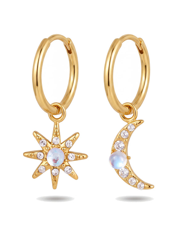 Star and moon huggie earrings in 18k gold plated stainless steel, mismatched pair on white
