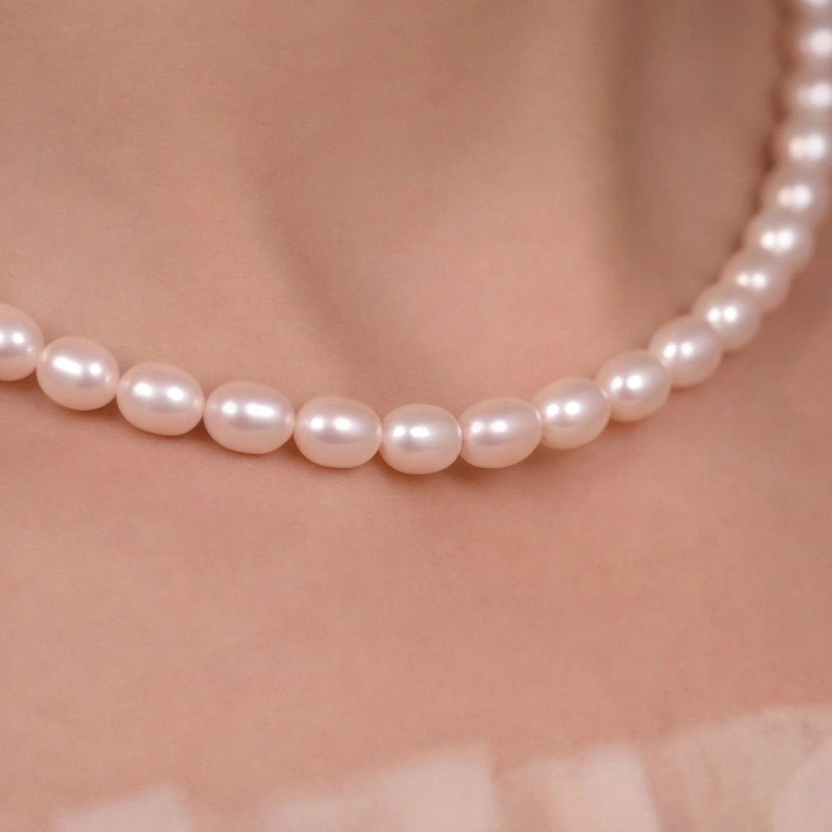 Modern rice pearl necklace styled on lifestyle background