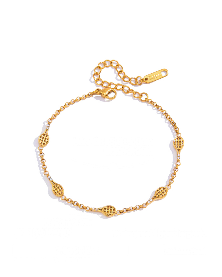 Rolo chain bracelet stationed with five small gold racquets on a white background