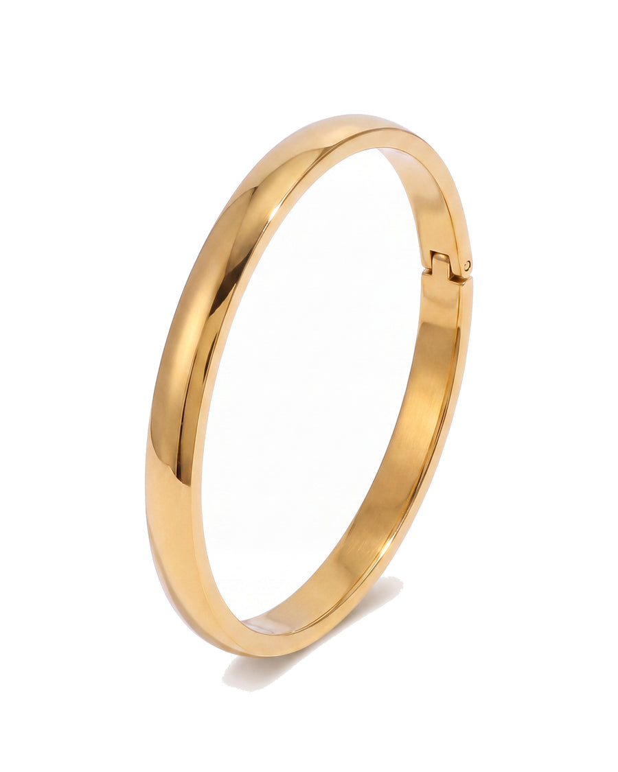 Narrow oval bangle in 18k gold plated stainless steel, on white