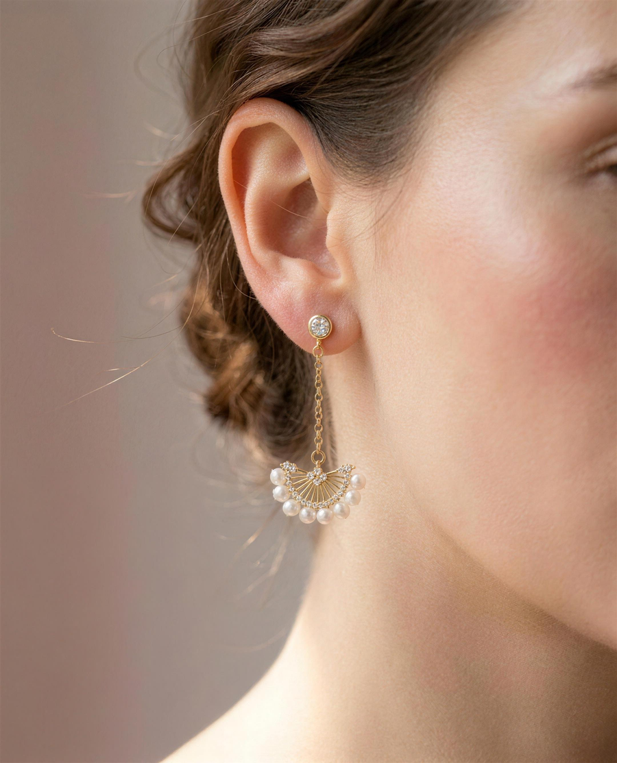 Freshwater pearl fan drop earrings worn on the ear, elegant length.