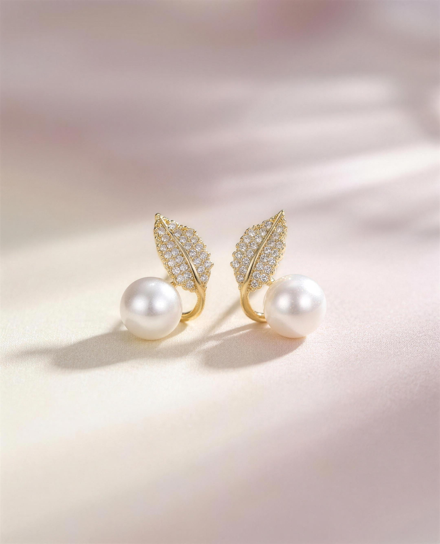Gold leaf freshwater pearl stud earrings, handcrafted in Ontario.