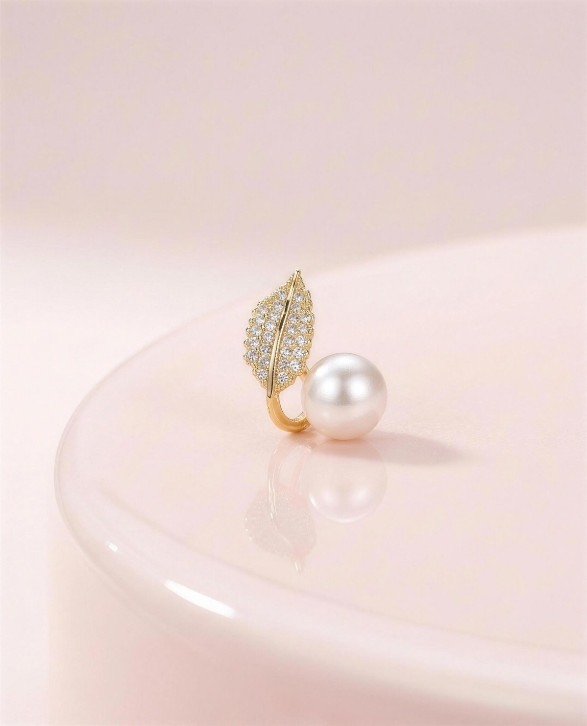 Gold leaf freshwater pearl stud earrings in our Ontario atelier.