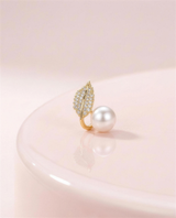 Gold leaf freshwater pearl stud earrings in our Ontario atelier.