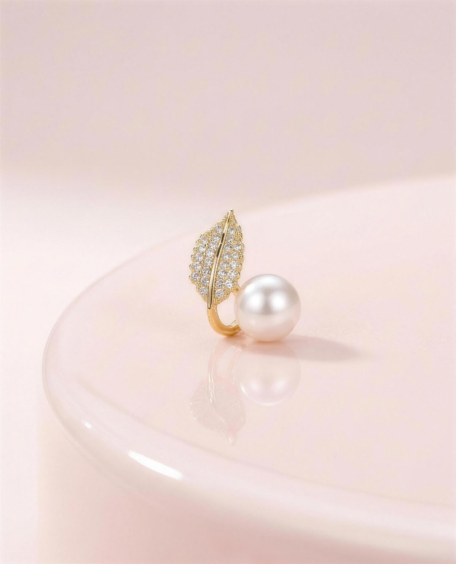 Gold leaf freshwater pearl stud earrings in our Ontario atelier.