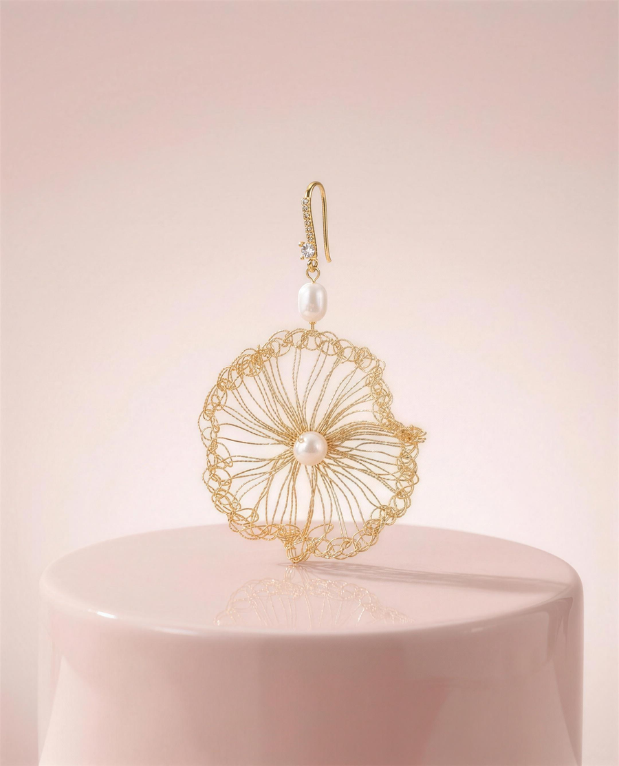 Gold wire freshwater pearl drop earrings in our Ontario atelier.