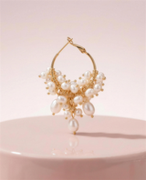 Freshwater pearl cascade hoop earrings in our Ontario atelier.