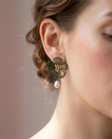 Freshwater pearl wildflower drop earrings shown close on the ear.