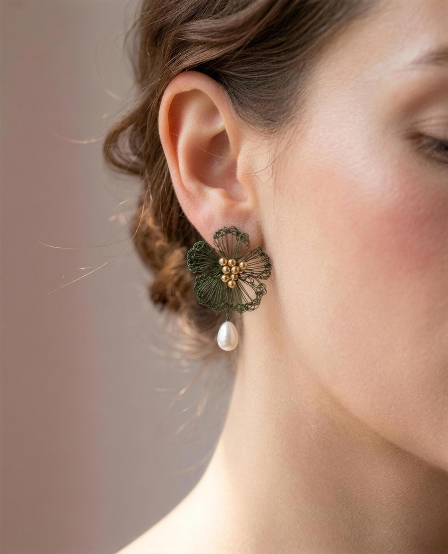 Freshwater pearl wildflower drop earrings shown close on the ear.
