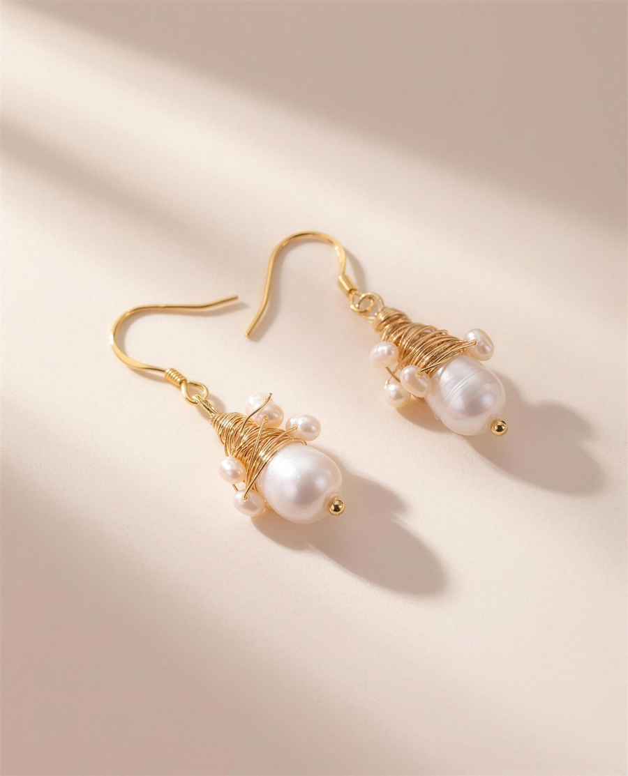 Wire-wrapped freshwater pearl drop earrings, handcrafted in Ontario.