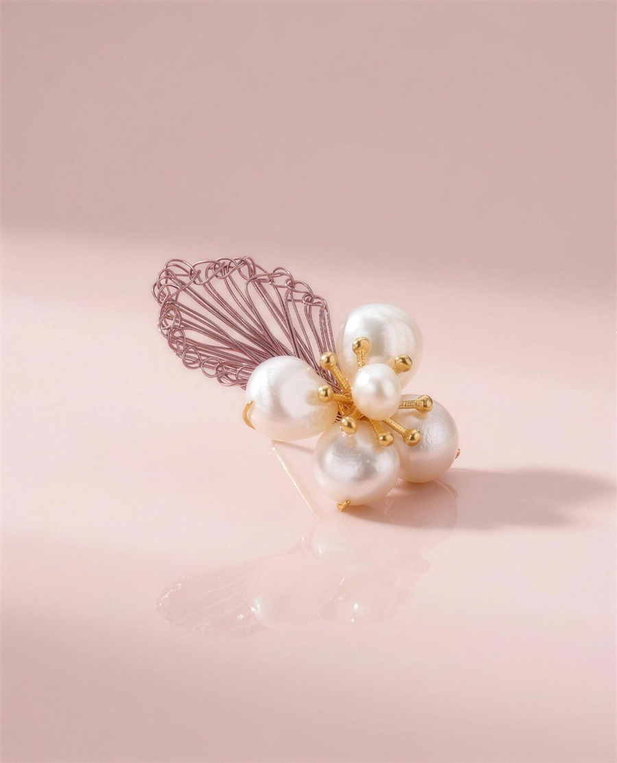 Baroque pearl blossom stud earrings in our Ontario atelier.