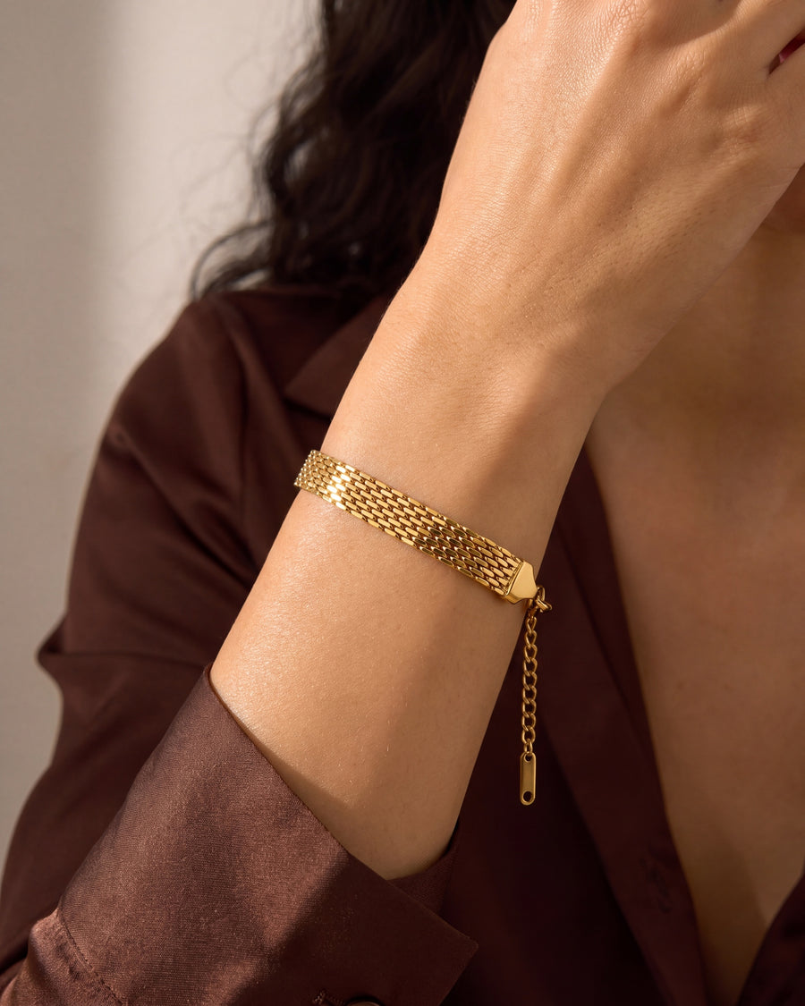 Woven mesh bracelet worn on the wrist, showing its slim everyday width