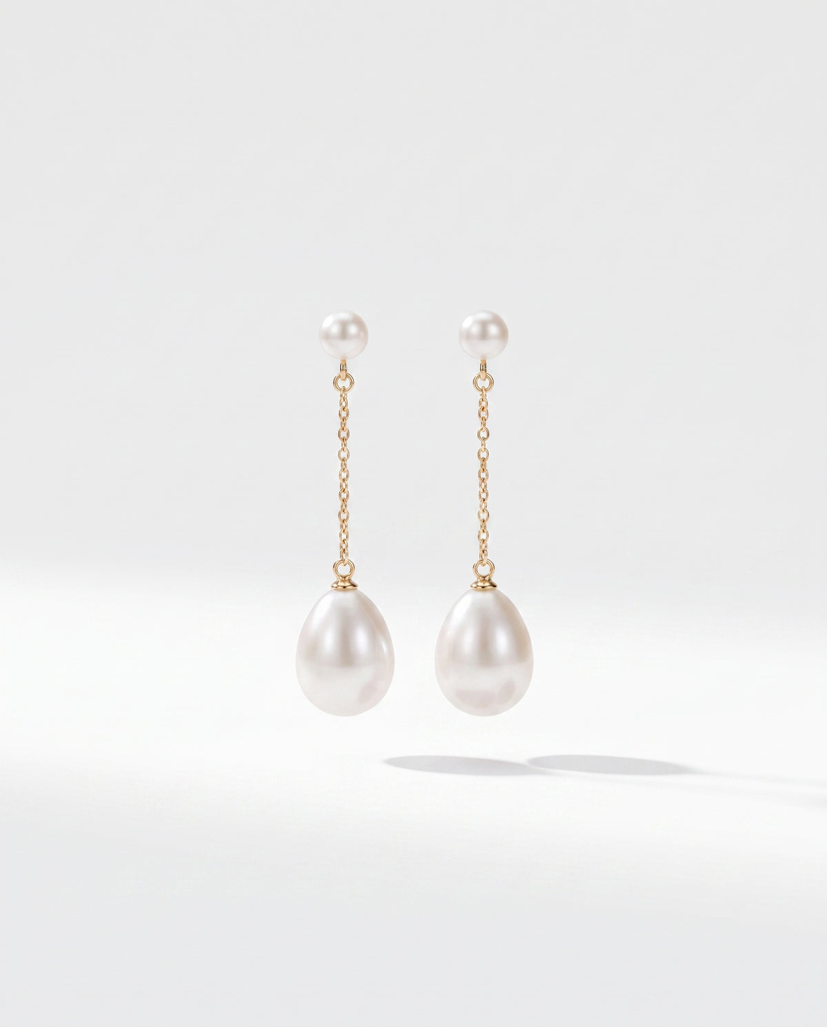 Fine Chain Pearl Drops freshwater pearl earring on a clean white background
