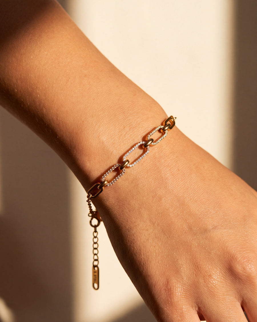 Pave link bracelet worn on the wrist, close macro view