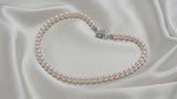 Premium Pearl Necklace with Gold Flower Clasp — styling video
