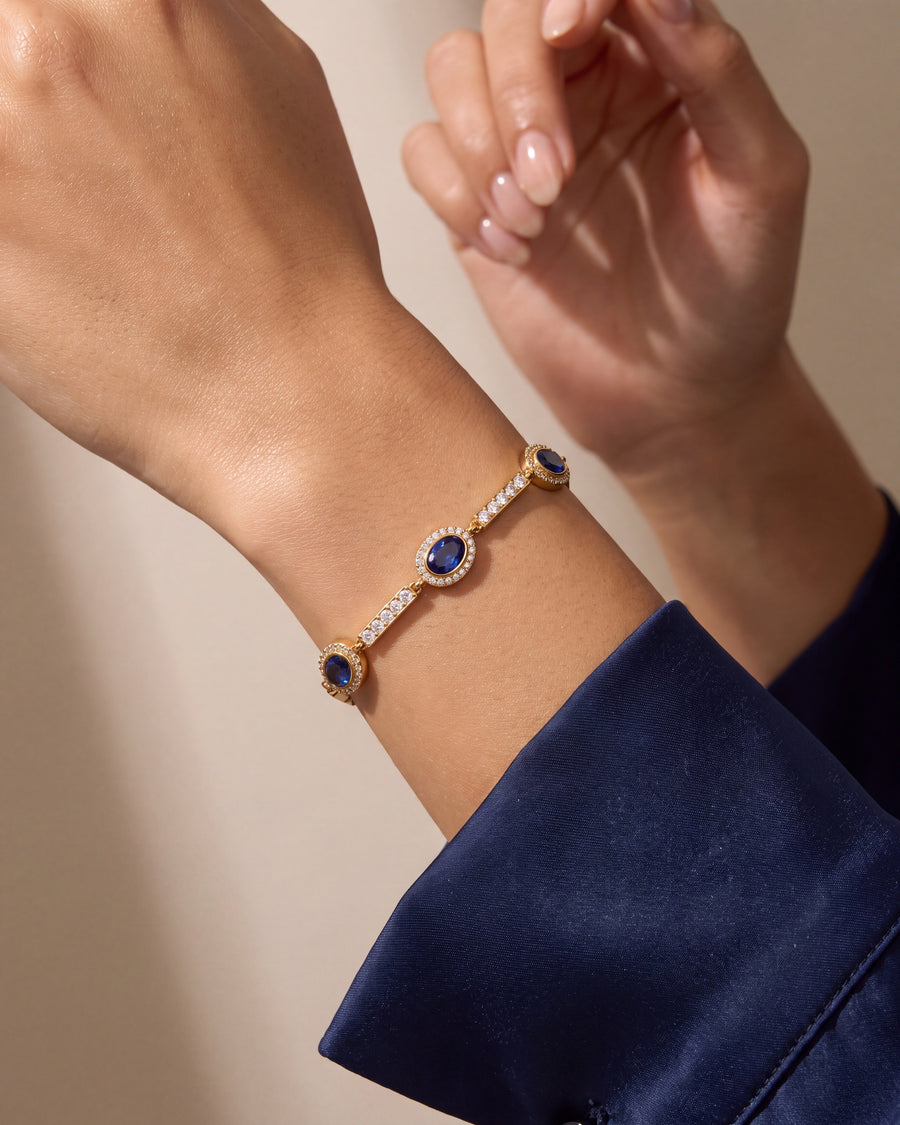 Sapphire halo bracelet worn on the wrist