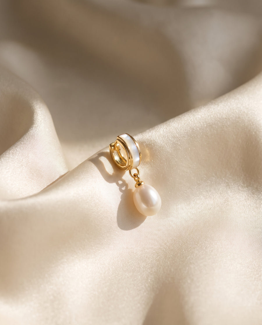 Shell Inlay Pearl Huggie Drops freshwater pearl earring draped on champagne ivory silk