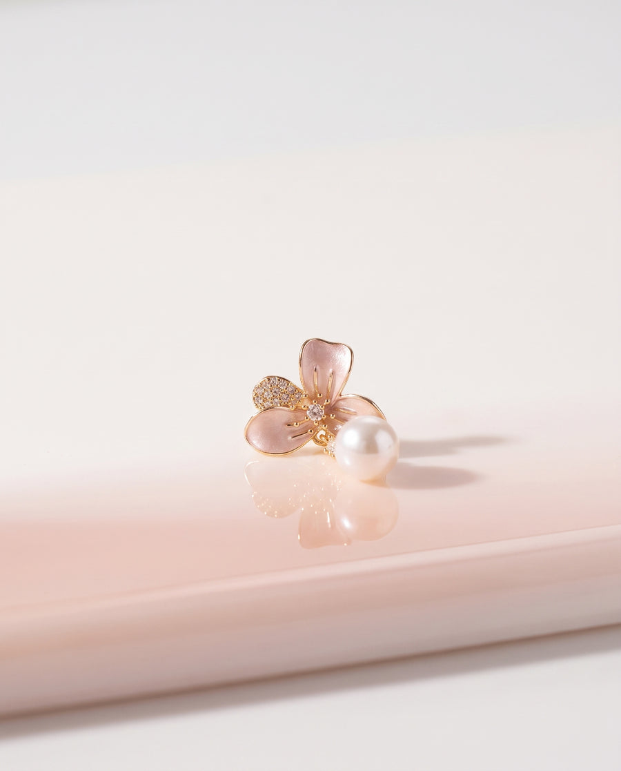 Blush Enamel Bloom Pearl Drops freshwater pearl earring on a glossy pedestal with soft reflection