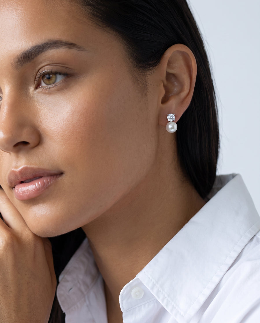 Solitaire and Pearl Studs freshwater pearl earring worn on the ear