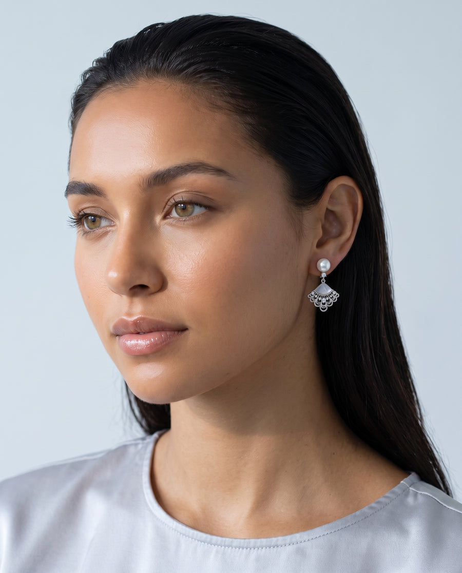 Fan Shell Pearl Drops freshwater pearl earring worn on the ear