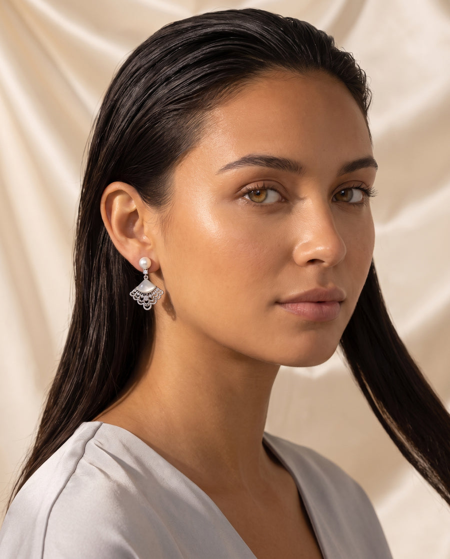 Fan Shell Pearl Drops freshwater pearl earring editorial portrait on champagne silk