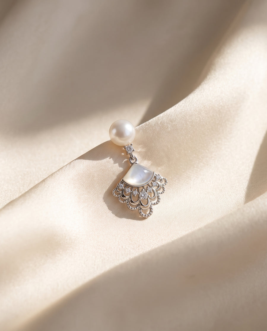 Fan Shell Pearl Drops freshwater pearl earring draped on champagne ivory silk