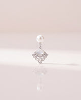 Fan Shell Pearl Drops freshwater pearl earring on a glossy pedestal with soft reflection